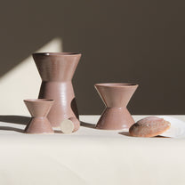 Set of ceramic vessels on a neutral background