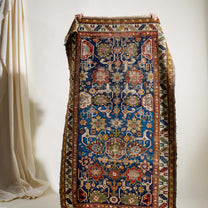 Decorative rug with intricate patterns on a white background