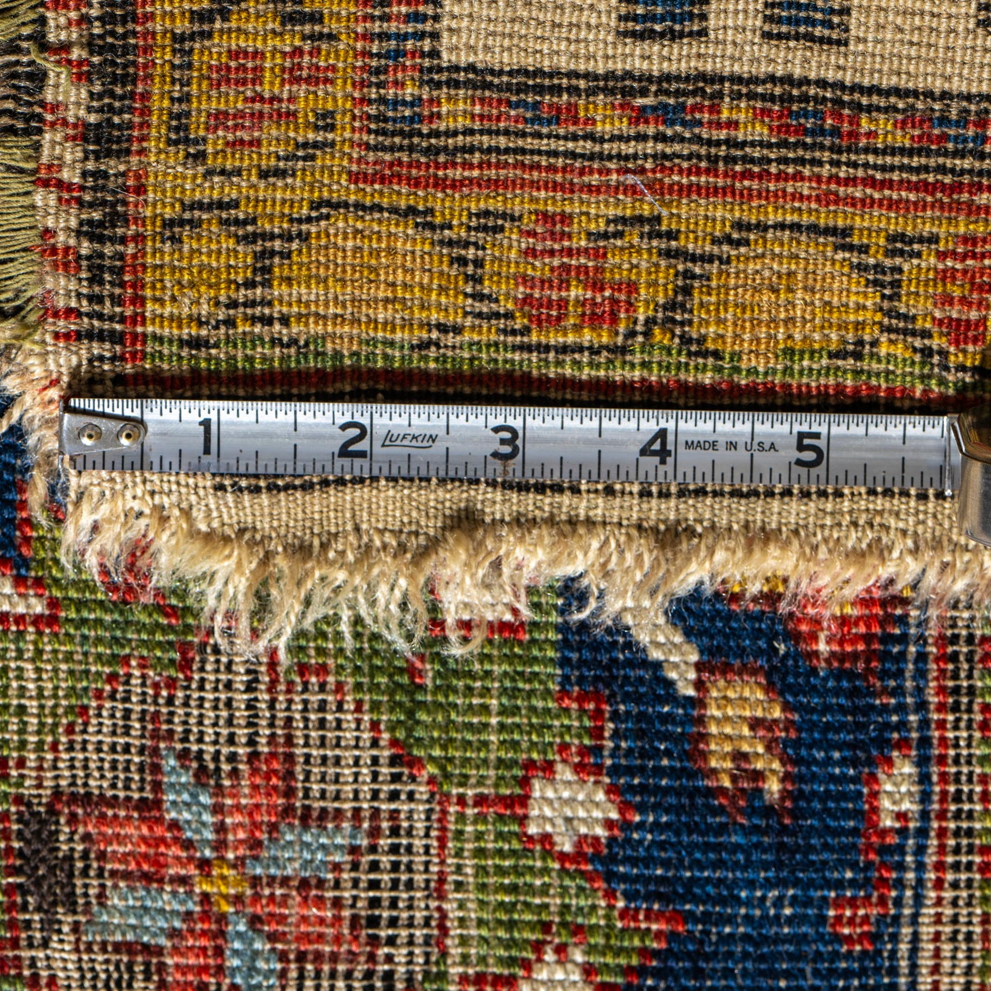 Rug with a measuring tape showing dimensions