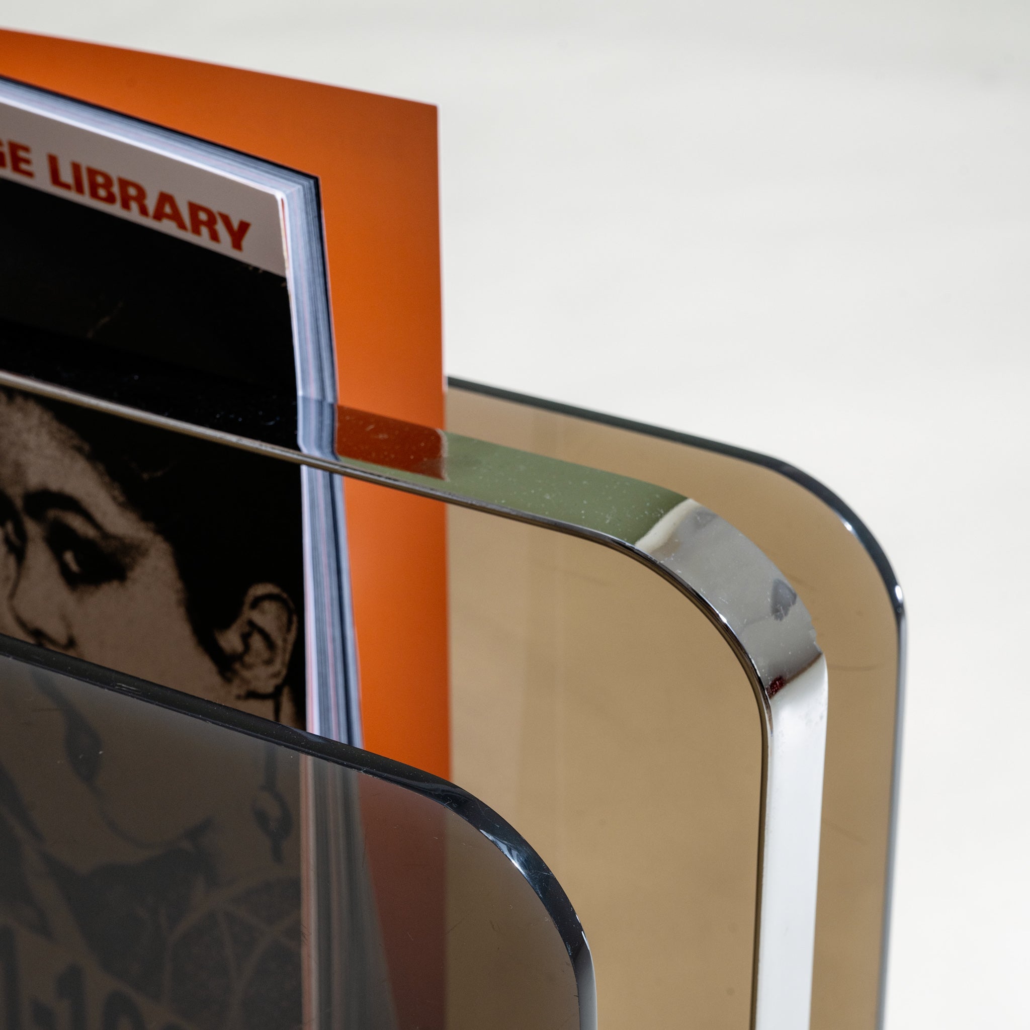 Close-up of a Milo Baughman magazine holder